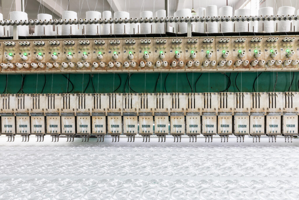 Lace machines on the production floor.